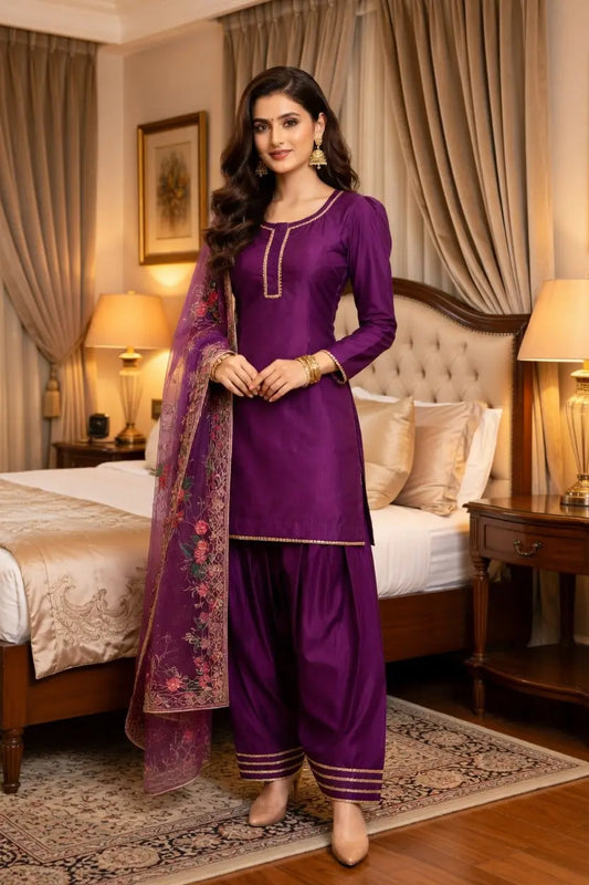 A three pice Straight kurta suit with stylish organza dopata & farshi shalwa in vibrant purple colour. Modishly USA